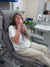 Patient drinking potassium iodide before a scan 